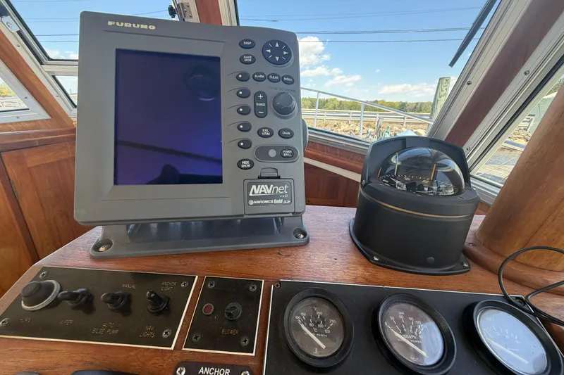Slide: The Image of Navigation equipment on a 1990 Cape Dory 28 Flybridge boat dashboard. - 4