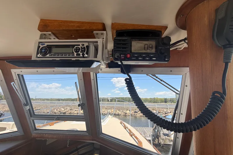 Slide: The Image of Interior view of a 1990 Cape Dory 28 Flybridge boat with radio equipment. - 5
