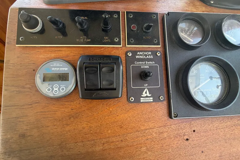Slide: The Image of Control panel of a 1990 Cape Dory 28 Flybridge boat with gauges and switches. - 6