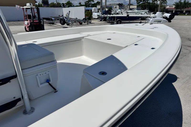 Slide: The Image of 2012 Pathfinder 2200 TRS boat interior, showcasing spacious seating and storage compartments. - 11