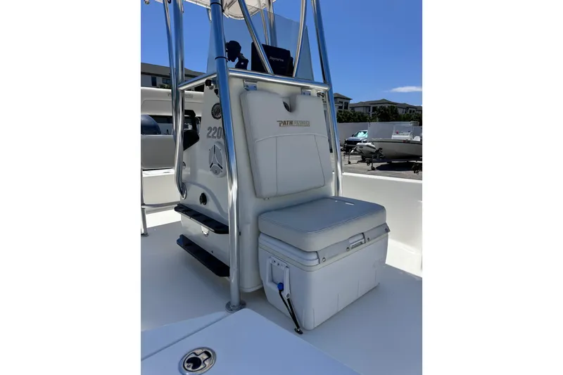 Slide: The Image of 2012 Pathfinder 2200 TRS boat interior with seating and storage. - 12