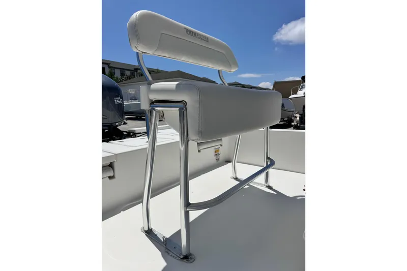 Slide: The Image of 2012 Pathfinder 2200 TRS boat seat with chrome frame under clear blue sky. - 14