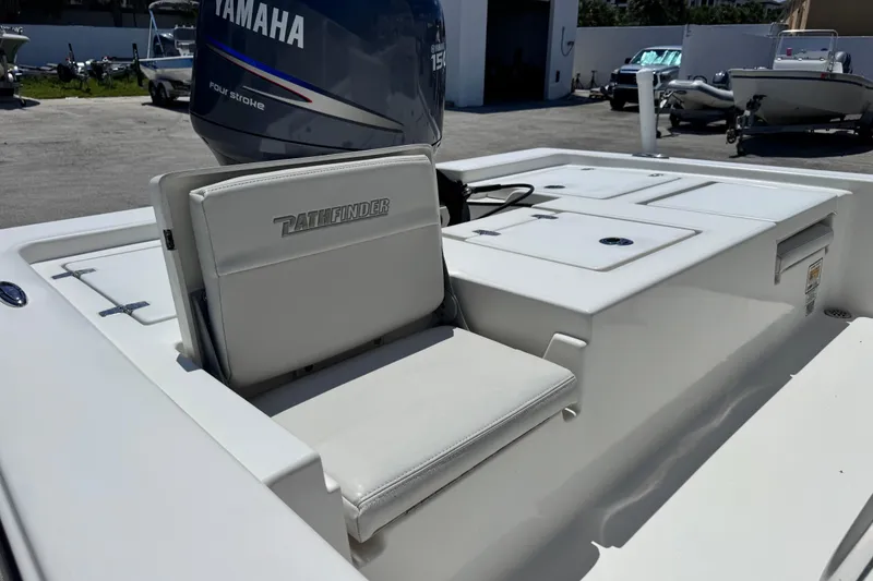 Slide: The Image of 2012 Pathfinder 2200 TRS boat with Yamaha engine, featuring cushioned seating and storage compartments. - 15
