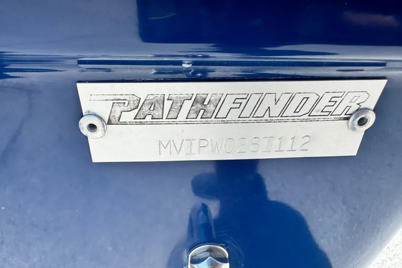 Slide: The Image of 2012 Pathfinder 2200 TRS nameplate on blue surface with serial number MVIPW028I112. - 16