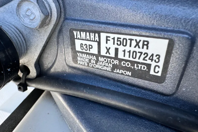 Slide: The Image of Close-up of Yamaha F150TXR engine label on a 2012 Pathfinder 2200 TRS. - 17