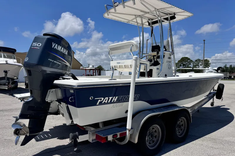 Slide: The Image of 2012 Pathfinder 2200 TRS boat with Yamaha 150 engine on trailer, sunny day. - 8