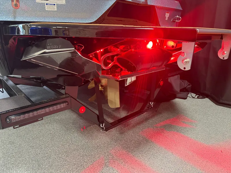 Slide: The Image of The image shows the stern of a MasterCraft XT23 boat with glowing red lights. - 8
