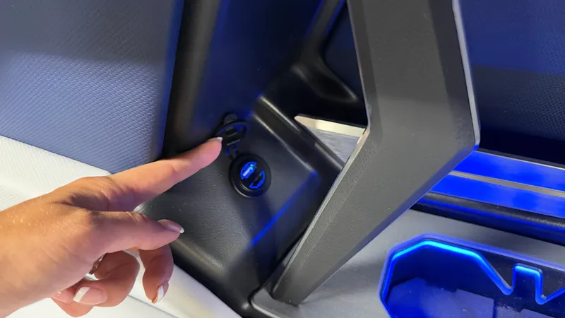 Slide: The Image of Close-up of a finger pointing at a USB port in a modern boat. - 29