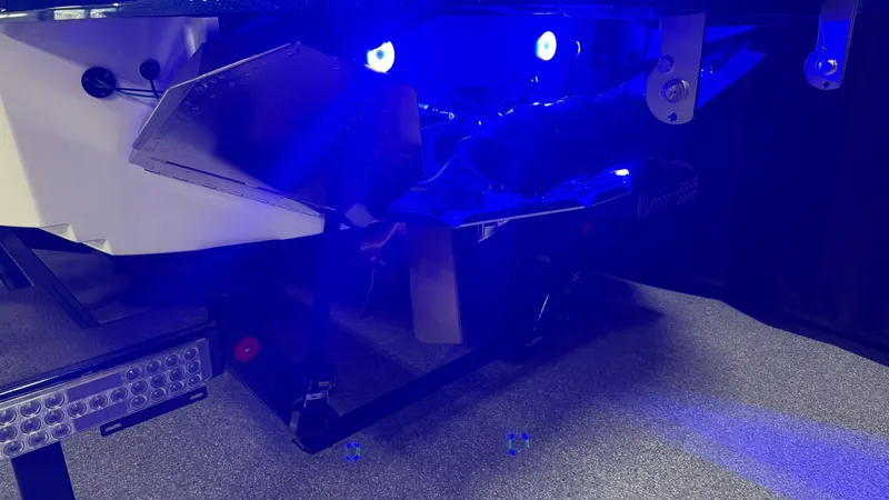 Slide: The Image of The image shows the underside of a MasterCraft XT23 boat with blue lighting. - 7