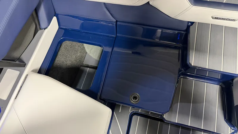 Slide: The Image of Interior of a 2027 MasterCraft XT23 with blue and gray accents. - 33