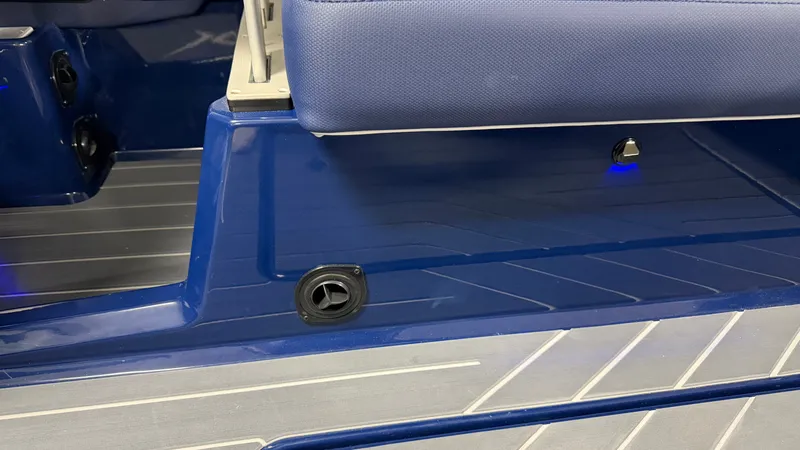 Slide: The Image of Close-up of a blue deck on a MasterCraft XT23 boat with seat cushion. - 25