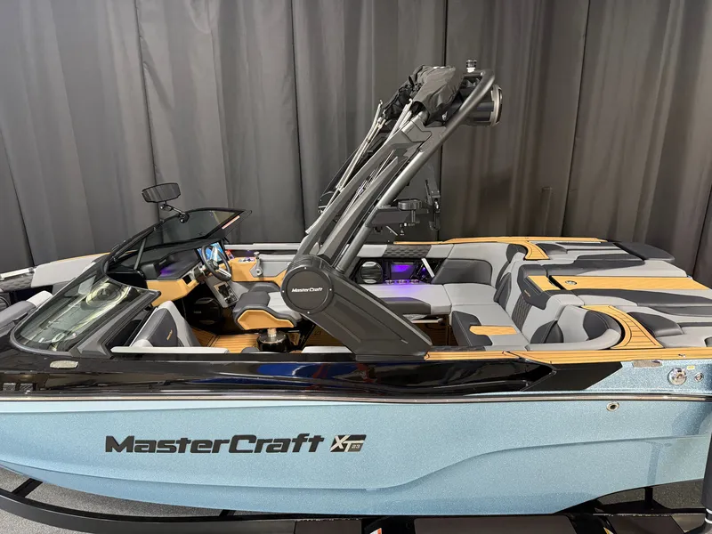 Slide: The Image of The image shows a modern 2027 MasterCraft XT23 boat with sleek design and luxurious interior. - 6
