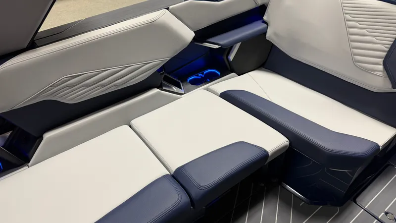 Slide: The Image of Interior of a 2027 MasterCraft XT23 with modern, cushioned seating and blue lighting. - 41