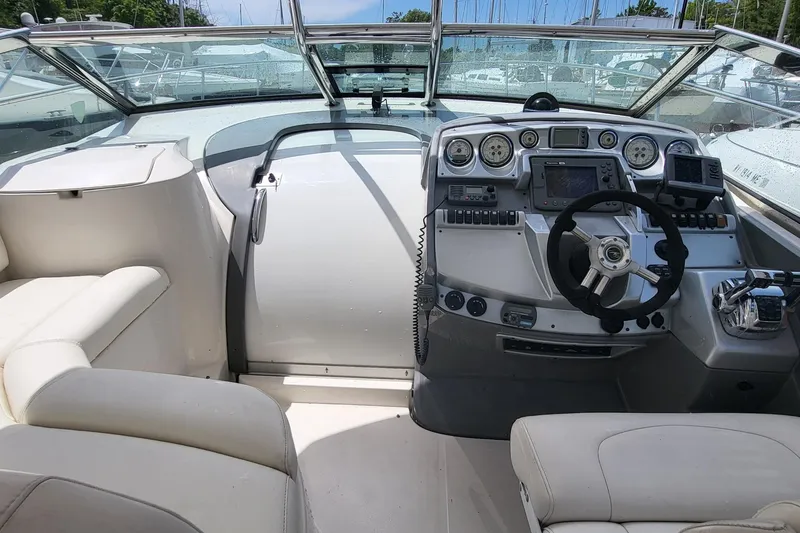 Slide: The Image of Cockpit of a 2008 Monterey 350 Sport Yacht with modern controls and seating. - 11