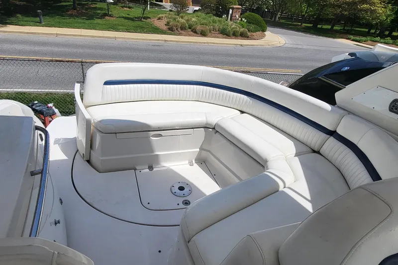 Slide: The Image of 2008 Monterey 350 Sport Yacht interior with white seating and blue accents. - 13