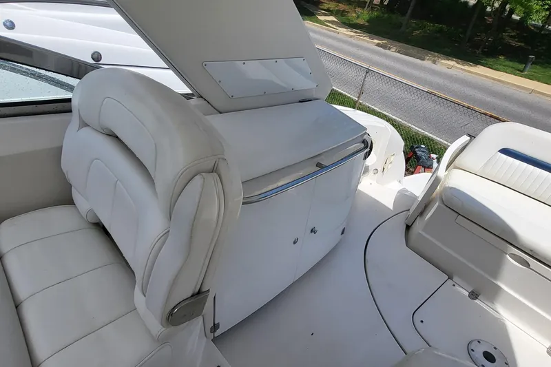 Slide: The Image of Interior of a 2008 Monterey 350 Sport Yacht with white seating and cabinetry. - 14