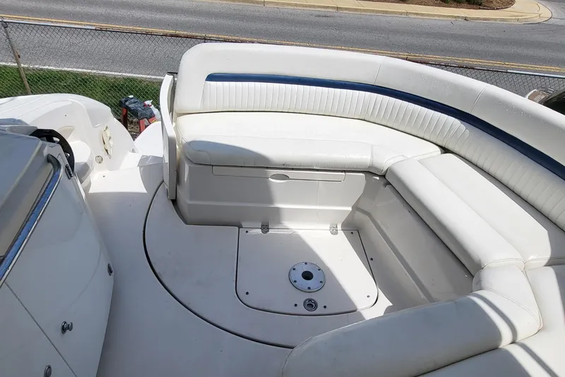 Slide: The Image of 2008 Monterey 350 Sport Yacht interior with white seating and deck view. - 15