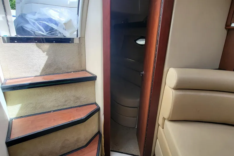 Slide: The Image of Interior view of 2008 Monterey 350 Sport Yacht, featuring stairs and seating area. - 21
