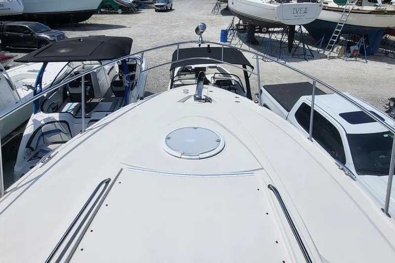Slide: The Image of 2008 Monterey 350 Sport Yacht on display in a marina, surrounded by other boats. - 7