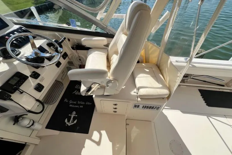 Slide: The Image of 2017 Grady-White Marlin 300 boat cockpit with steering wheel and seating. - 24