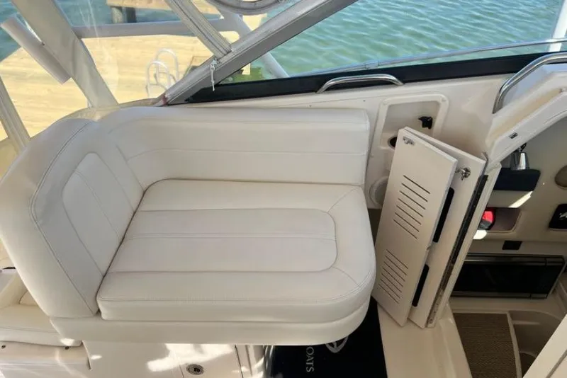 Slide: The Image of White seating area on a 2017 Grady-White Marlin 300 boat interior. - 26