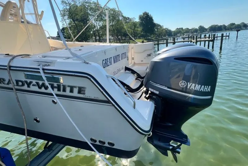 Slide: The Image of 2017 Grady-White Marlin 300 boat with Yamaha engine on a serene lake. - 3