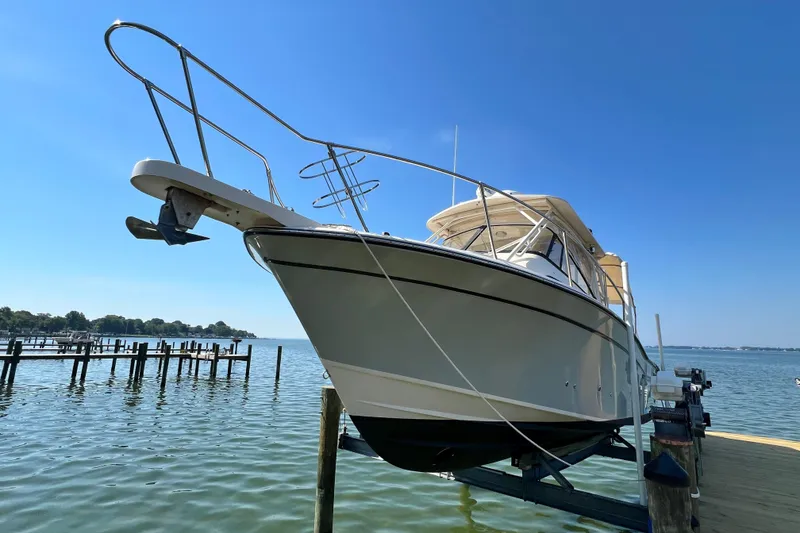 Slide: The Image of 2017 Grady-White Marlin 300 boat docked on a sunny day. - 31