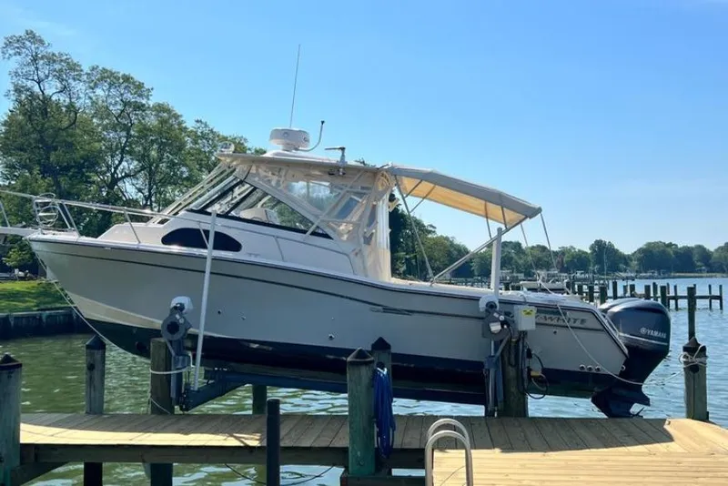 Slide: The Image of 2017 Grady-White Marlin 300 boat docked on a sunny day. - 33