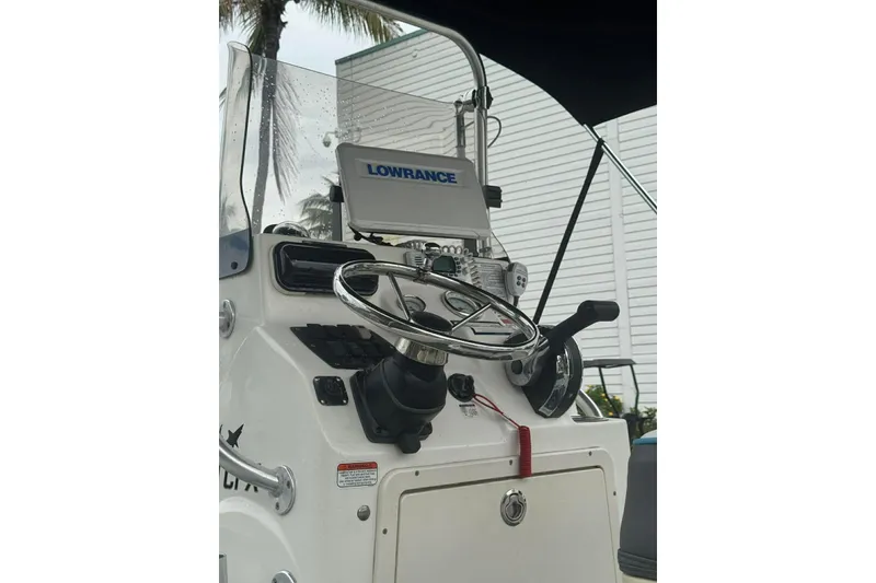 Slide: The Image of Control panel of a 2015 Mako 19 CPX boat with Lowrance navigation system. - 7