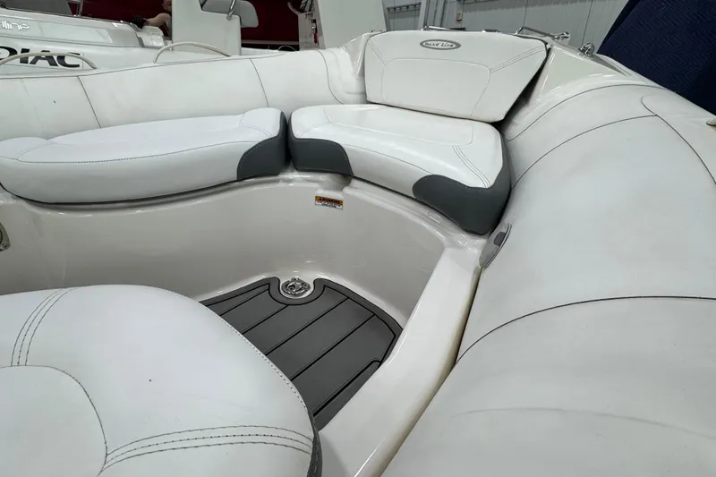 Slide: The Image of Luxurious seating area on a 2021 Zodiac Yachtline 440 boat, featuring white cushioned seats. - 11