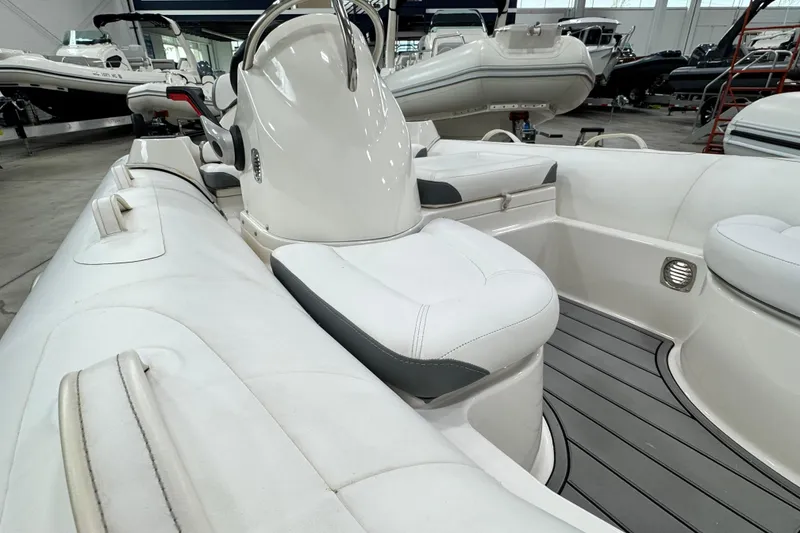 Slide: The Image of 2021 Zodiac Yachtline 440 boat interior with white seating and sleek design. - 12
