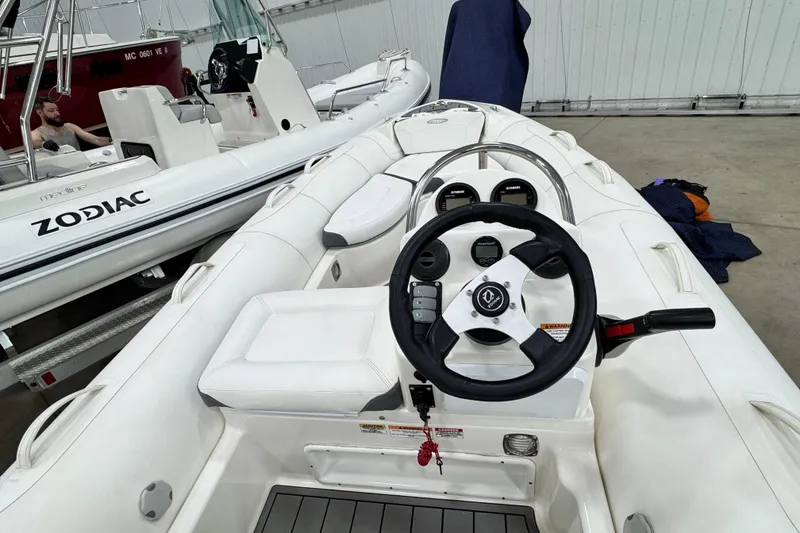 Slide: The Image of 2021 Zodiac Yachtline 440 inflatable boat interior with steering wheel and controls. - 15