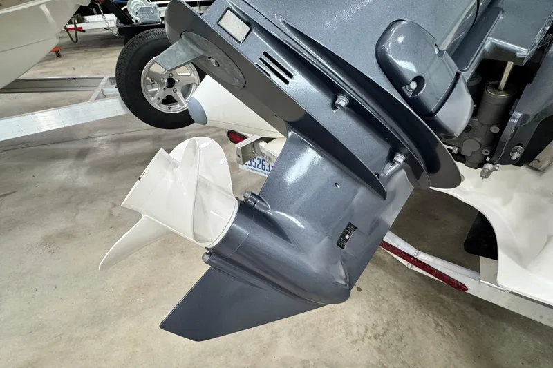 Slide: The Image of Outboard motor of 2021 Zodiac Yachtline 440 on a trailer in a garage. - 3