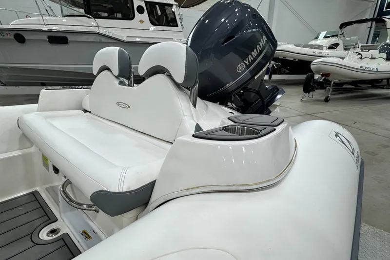 Slide: The Image of 2021 Zodiac Yachtline 440 with Yamaha engine, featuring white seating and sleek design. - 4