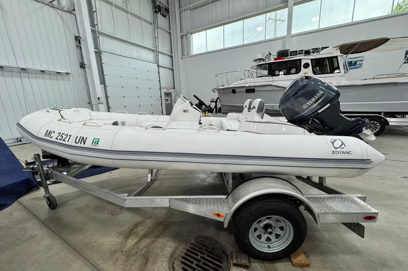 Slide: The Image of 2021 Zodiac Yachtline 440 inflatable boat on trailer in indoor storage facility. - 6