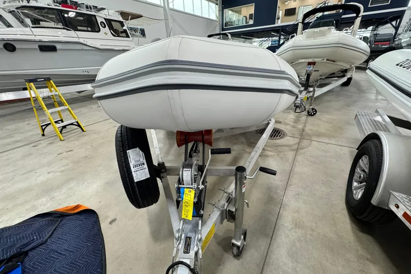Slide: The Image of 2021 Zodiac Yachtline 440 inflatable boat on trailer in showroom. - 7