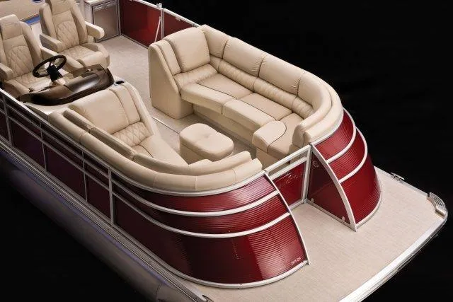 Slide: The Image of Manufacturer Provided Image: 2015 Bennington 2575 QSD pontoon boat with luxurious beige seating and red exterior. - 2