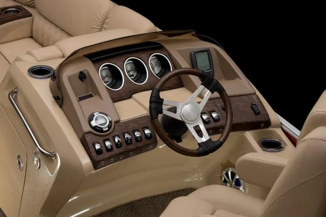 Slide: The Image of Manufacturer Provided Image: 2015 Bennington 2575 QSD boat dashboard with steering wheel and control panel. - 3
