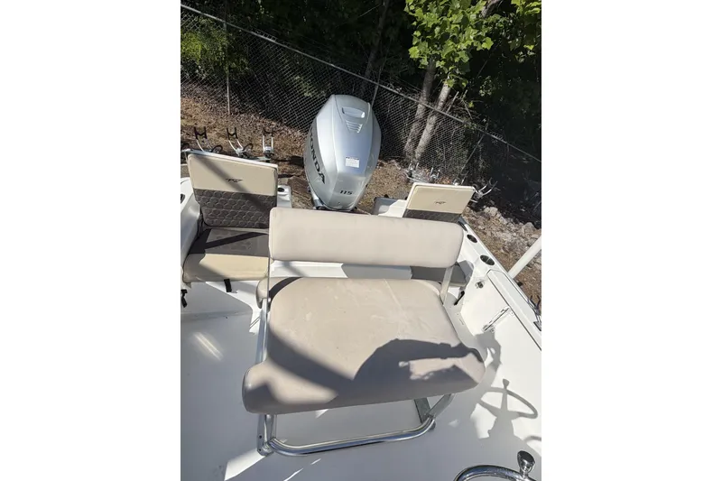 Slide: The Image of 2018 Tidewater 1910 Bay Max boat interior with seating and Honda outboard motor. - 5