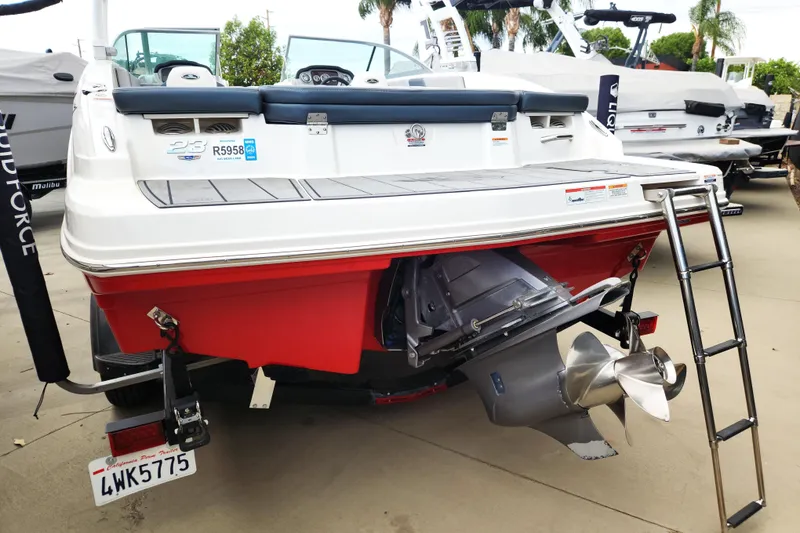 Slide: The Image of 2021 Chaparral 23 SSi boat rear view with propeller and ladder. - 3