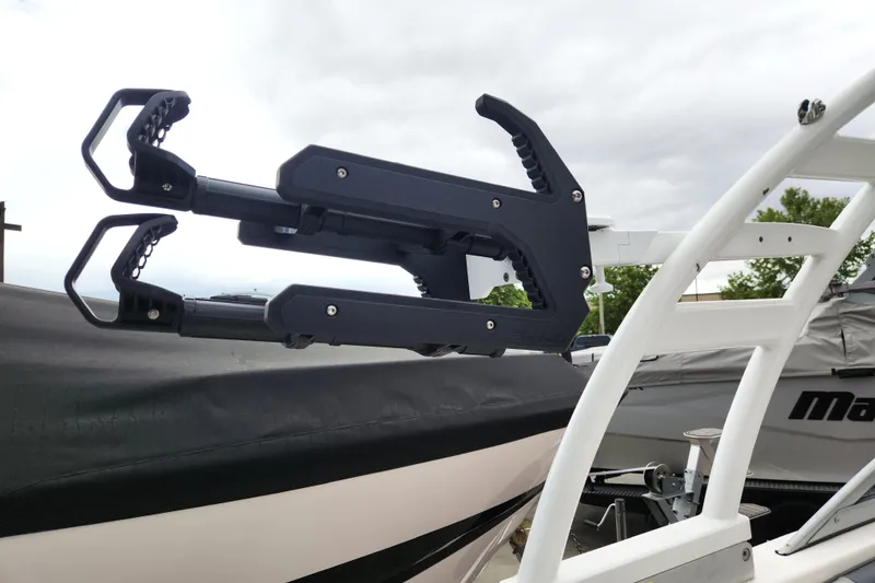 Slide: The Image of Wakeboard rack on a 2021 Chaparral 23 SSi boat, overcast sky background. - 7