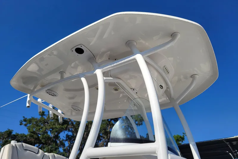 Slide: The Image of Tidewater 2700 Carolina Bay 2020 boat T-top against clear blue sky. - 8
