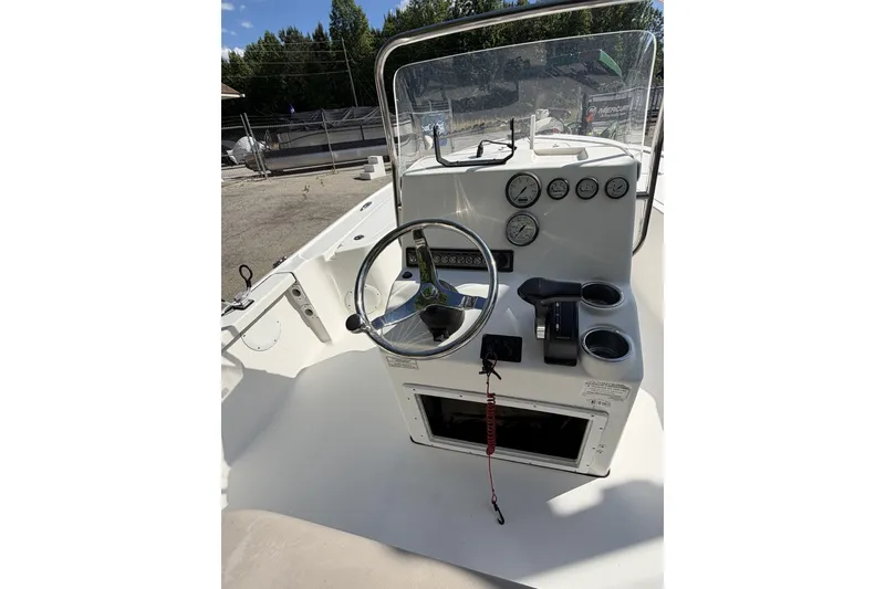 Slide: The Image of 2018 Tidewater 1910 Bay Max boat console with steering wheel and gauges. - 6