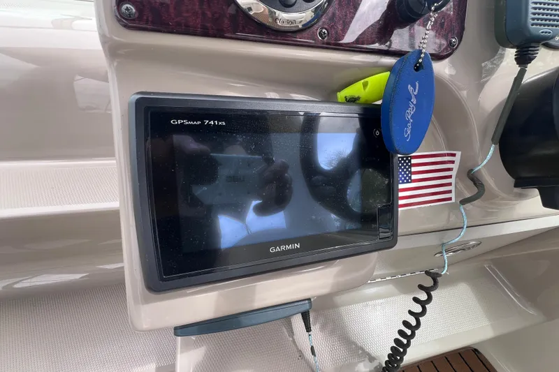 Slide: The Image of Garmin GPSMAP 741xs on 2006 Sea Ray Sundancer 260 dashboard with American flag sticker. - 11