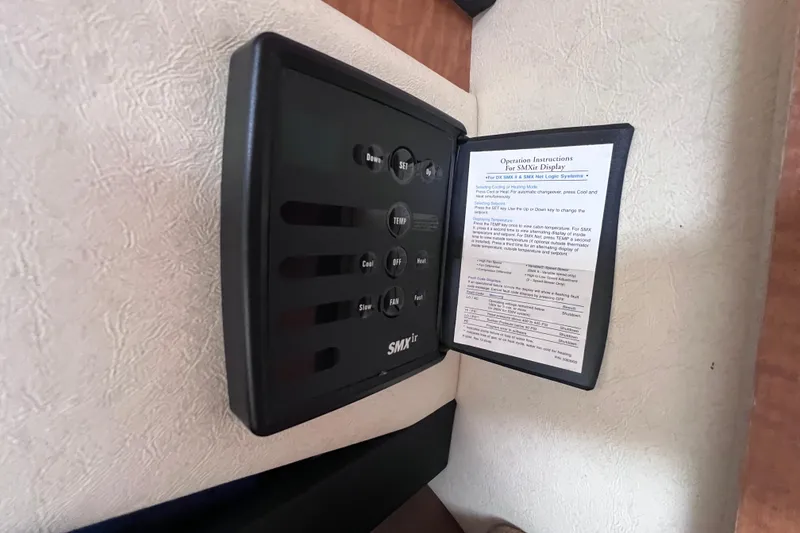 Slide: The Image of SMXir control panel with operation instructions on a 2006 Sea Ray Sundancer 260 yacht. - 19