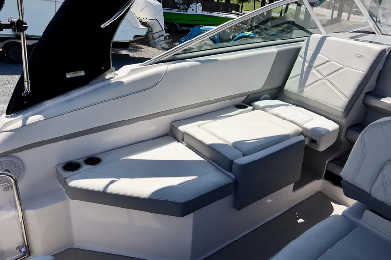 Slide: The Image of 2023 Regal 26 XO boat interior with luxurious seating and cup holders. - 15
