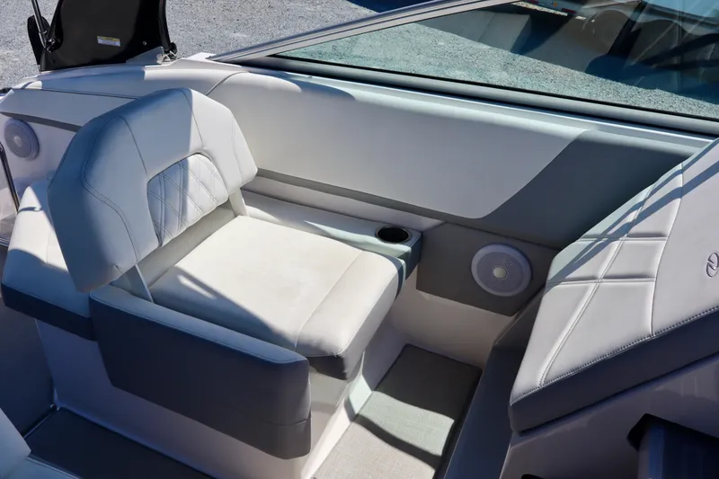 Slide: The Image of Luxurious seating on 2023 Regal 26 XO boat with cup holder and speaker. - 25