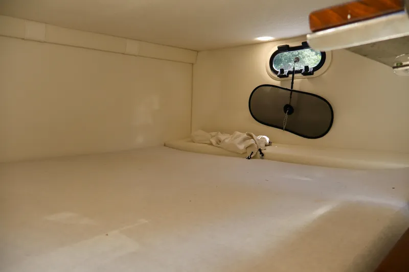 Slide: The Image of Interior cabin of 2023 Regal 26 XO boat, featuring a cozy sleeping area. - 37