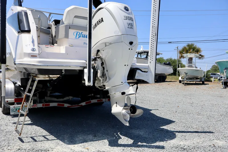 Slide: The Image of 2023 Regal 26 XO boat with Yamaha 300 V6 engine on a trailer. - 7
