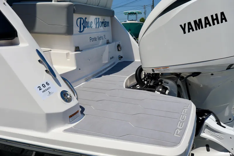 Slide: The Image of 2023 Regal 26 XO boat with Yamaha engine, featuring "Blue Horizon" branding, docked in Ponte Vedra, FL. - 8